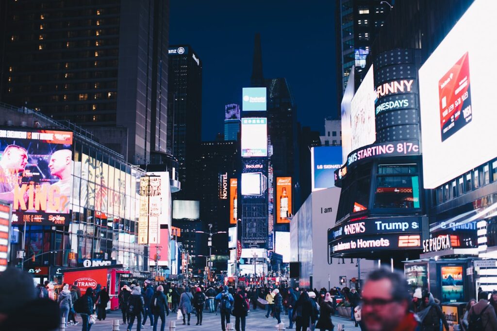pexels-photo-1634278 Bustling night scene in Times Square, New York City, illuminated with vibrant advertisements.